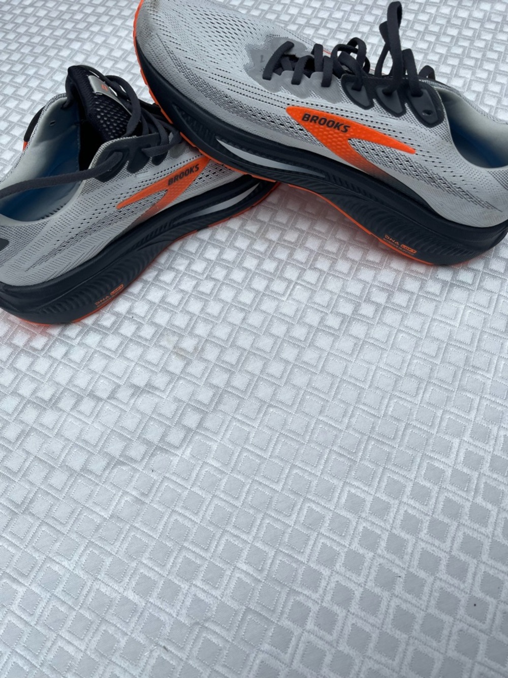 Brooks Men's Running Shoe in Light Gray with Orange and Blue Accents